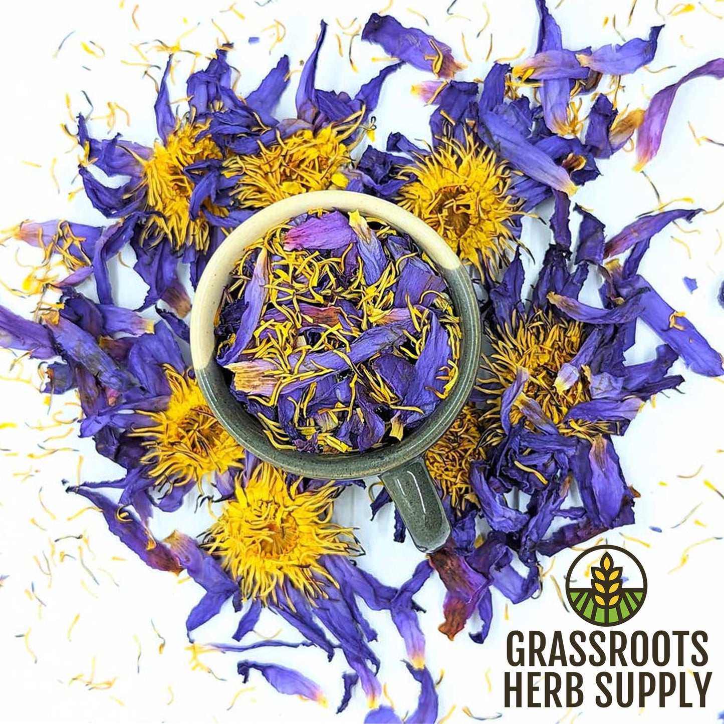 Dried purple and yellow flowers with a mug on a white background, featuring Grassroots Herb Supply logo.