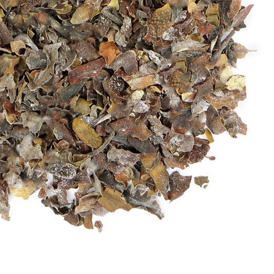 Close-up of dried herbs on a white background