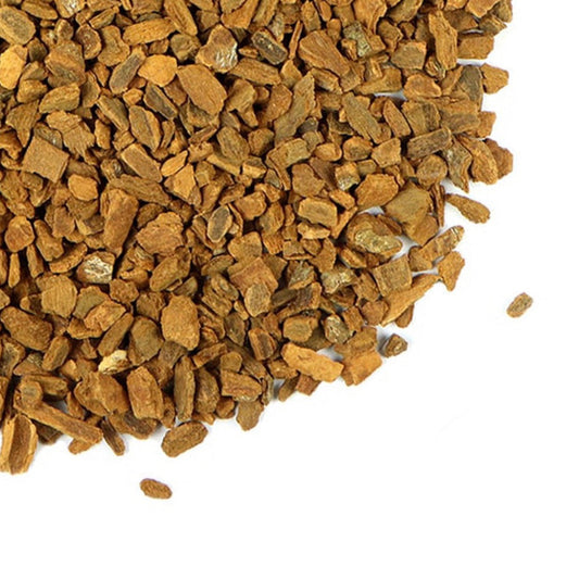 A close-up of cassia cinnamon chips with the Grassroots Herb Supply logo.