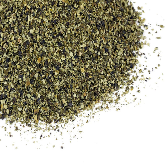 A close-up image of dried, ground kelp granules with the Grassroots Herb Supply logo in the bottom right corner.