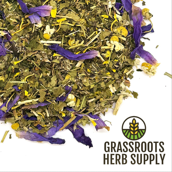 Herbal mix with purple and yellow flowers on a white background, branded as Grassroots Herb Supply.