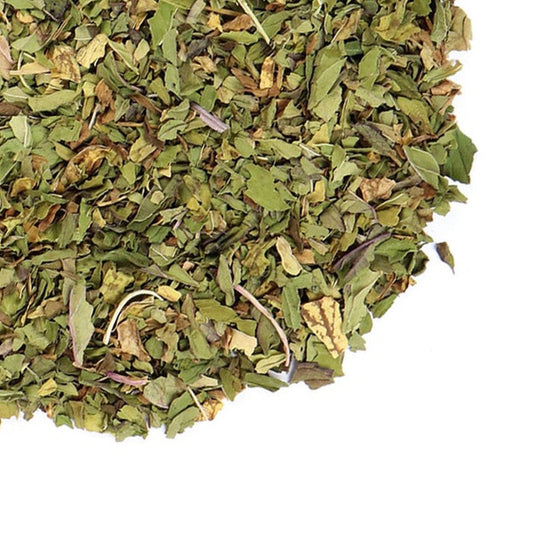 A close-up image of dried peppermint leaves with the logo of Grassroots Herb Supply.