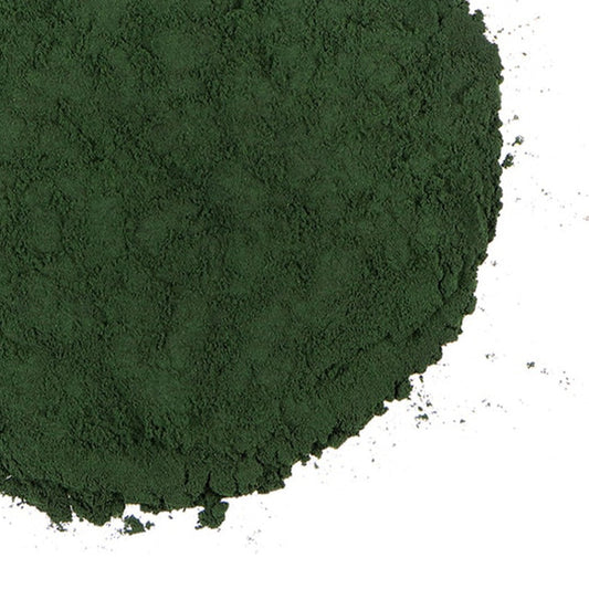 Green powder with Grassroots Herb Supply logo on a white background