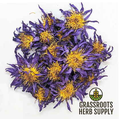 Purple flowers with yellow centers on a white background, branded with Grassroots Herb Supply.